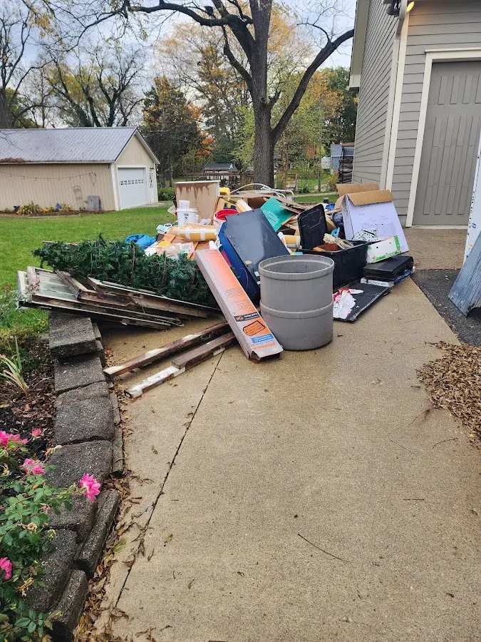 Dumpster being loaded with debris for Commercial Dumpster Rental in Union Park